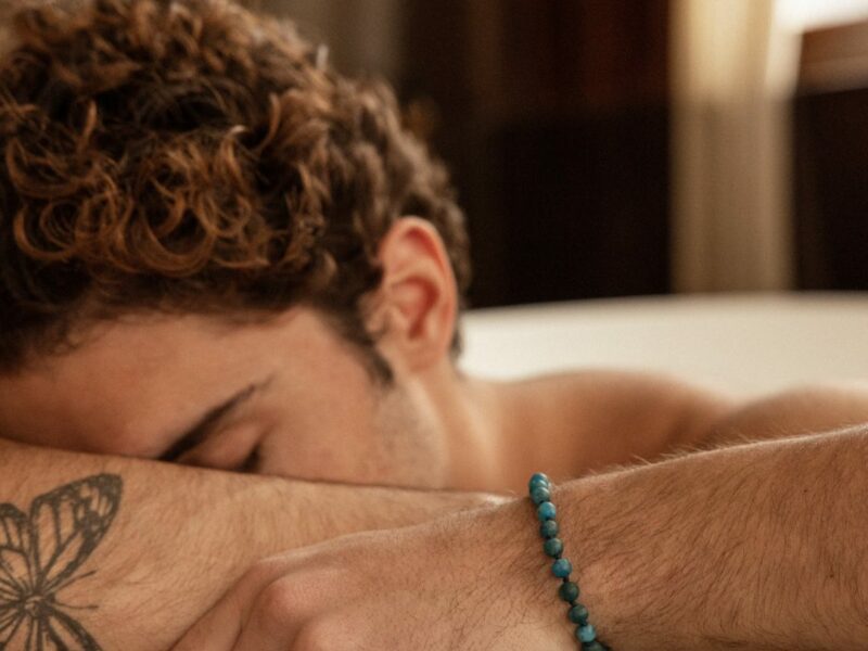 a man wearing a greek handmade bracelet