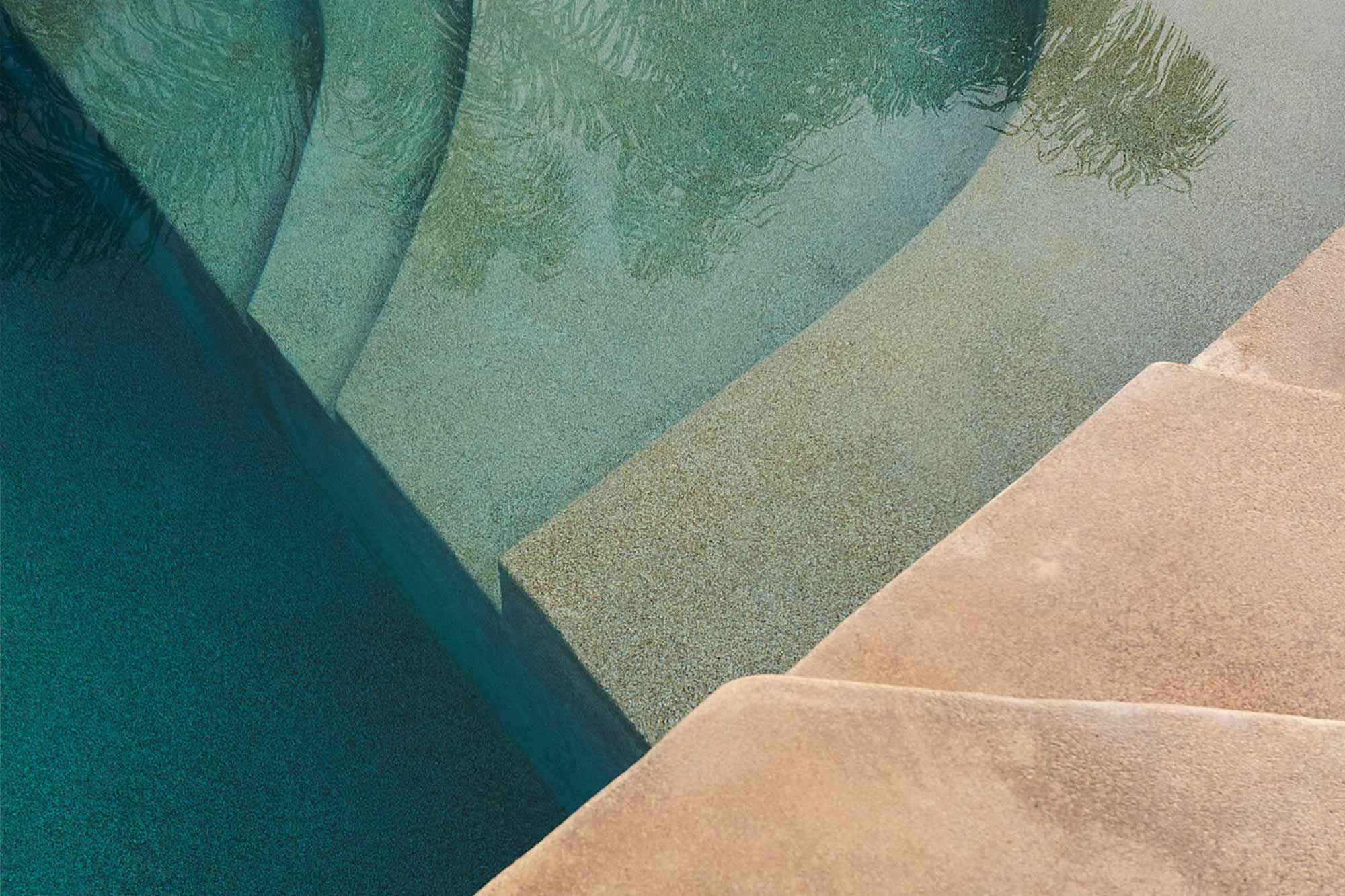 stoned stairs of a rooftop pool on a hotel in Athens