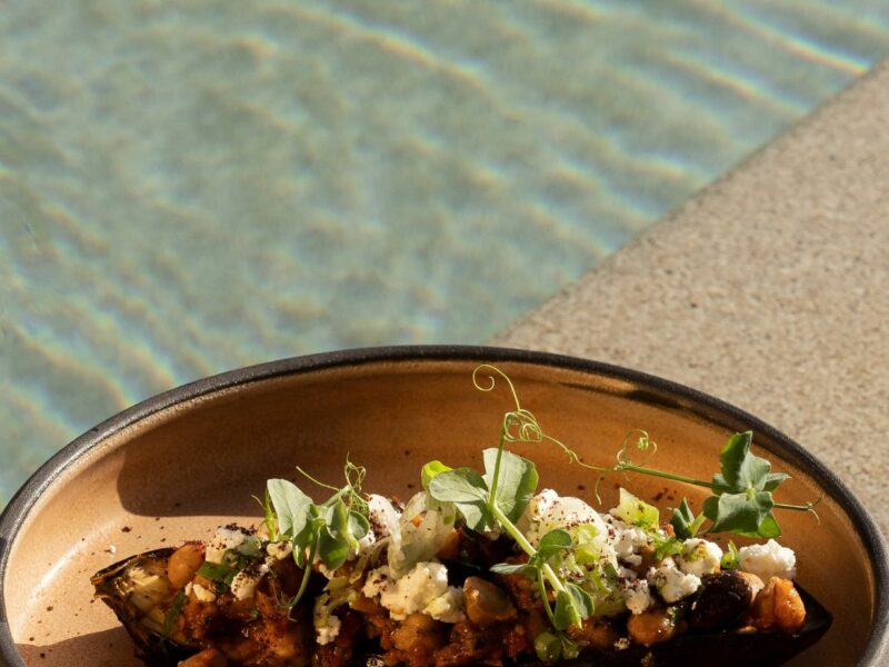 a plate of authentic Greek food on a hotel with rooftop pool in Athens