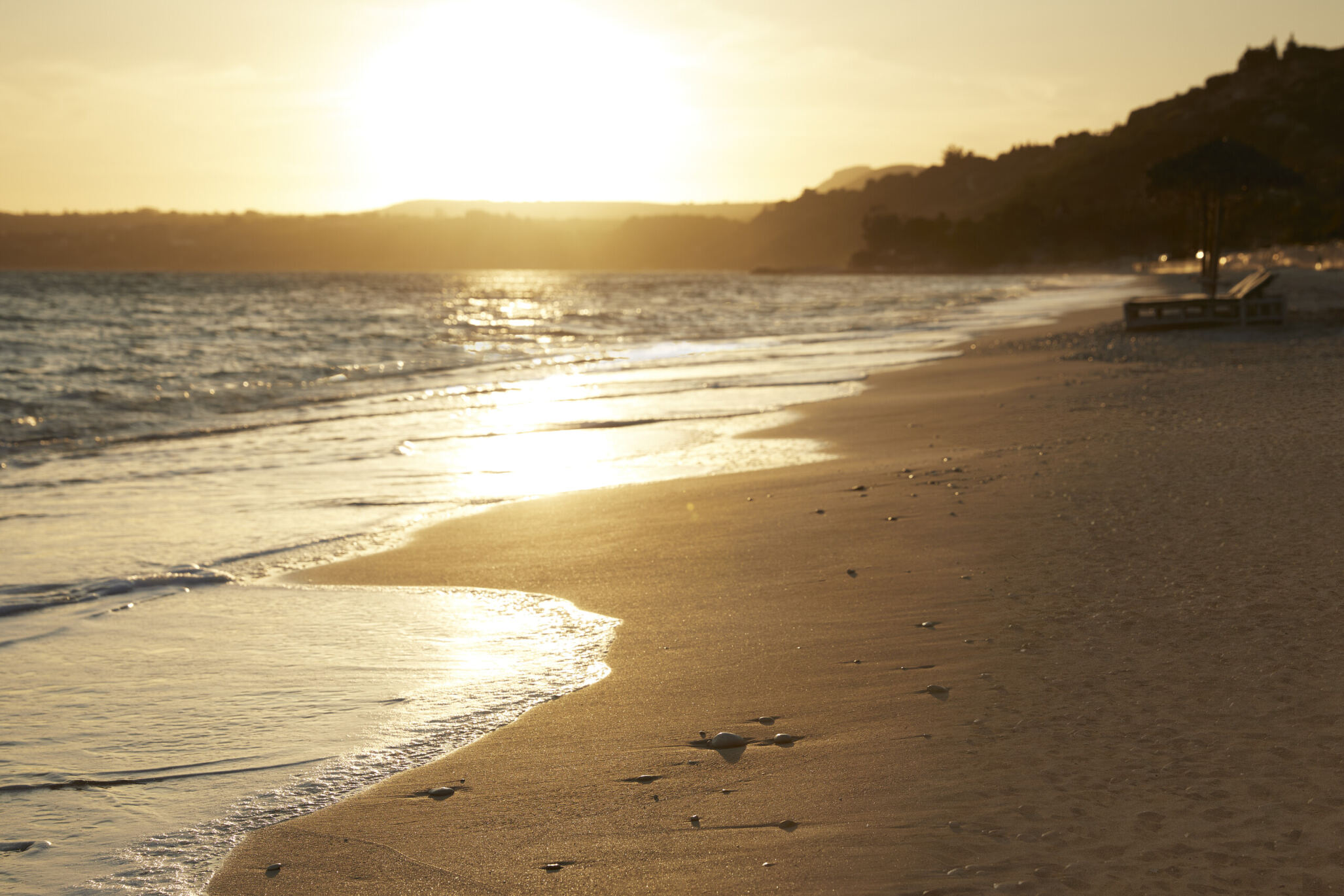 the sea touches the sand