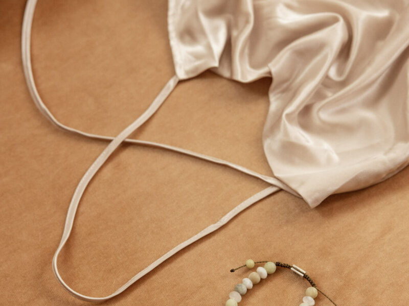 Handmade bracelet and a dress made by greek designers