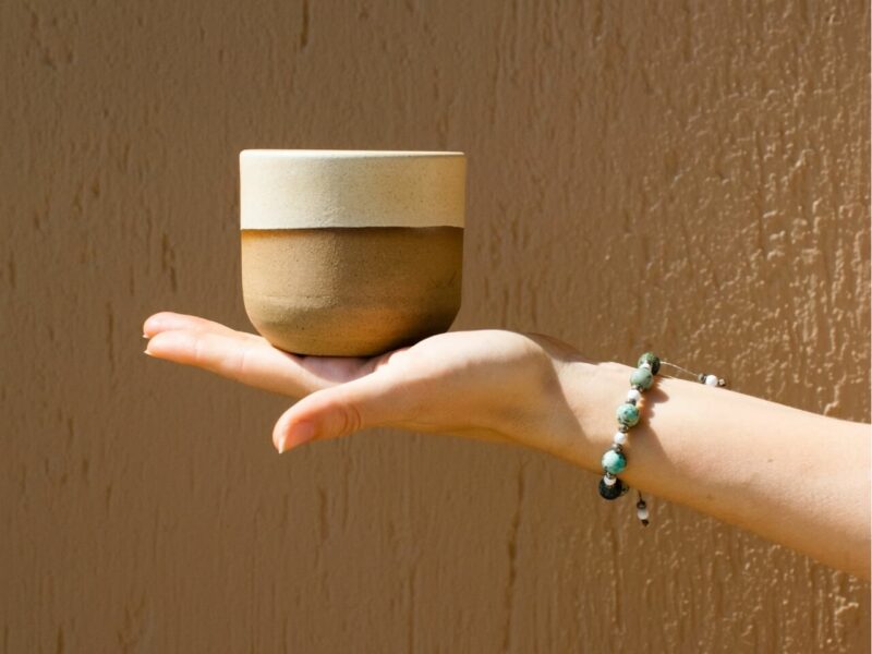 a hand with handmade greek bracelet