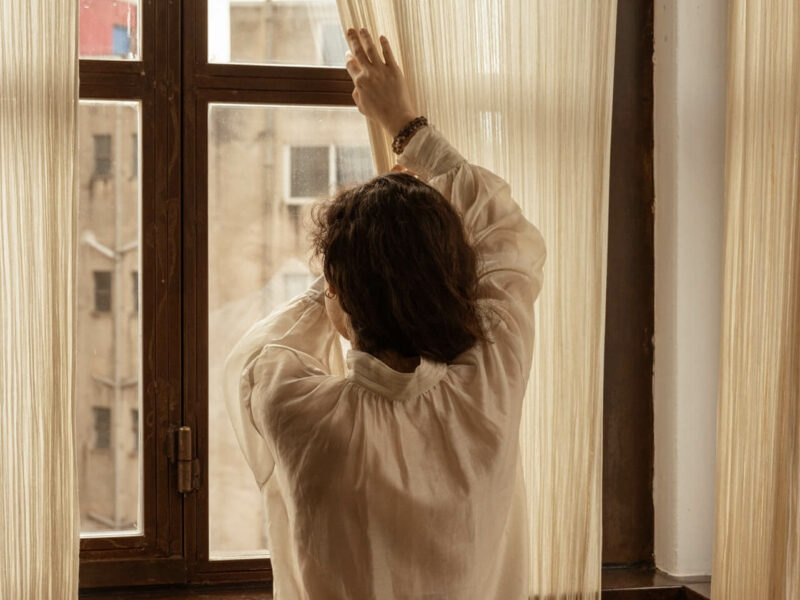 window view of a person wearing Greek handmade products