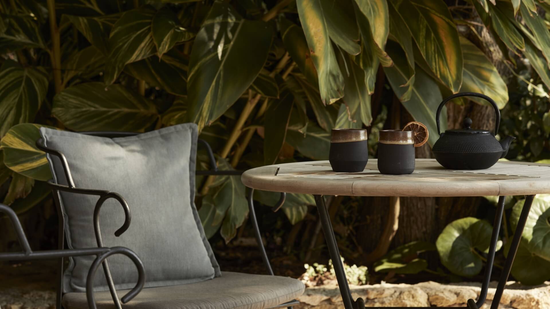 chair and table with tea