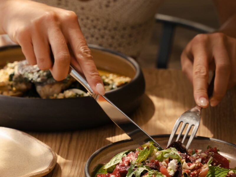 a man eating in a luxury authentic greek restaurant