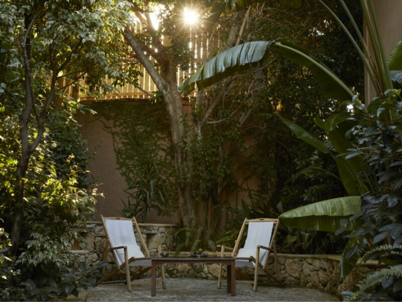 a yard with two chairs at a boutique hotel in greece