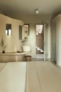 Minimal design of a bedroom in luxury suites in Athens