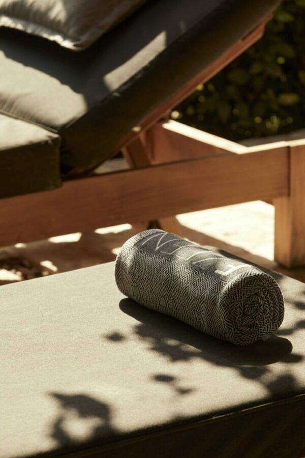 Towel on a sunbed in a luxury retreat in Greece