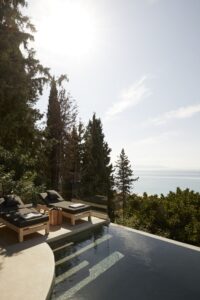 sunbeds on a private pool with sea view