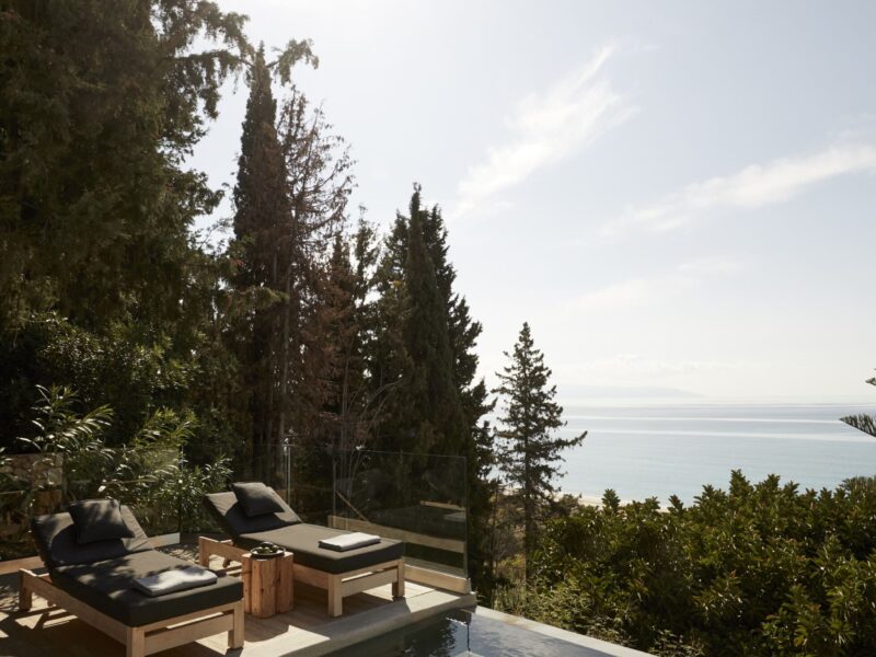 sunbeds on a private pool with sea view