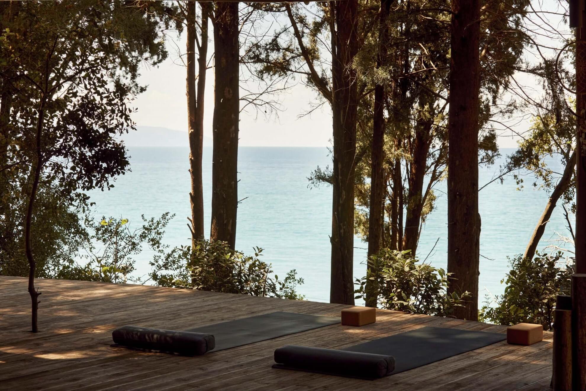yoga mattresses on a wooden patio