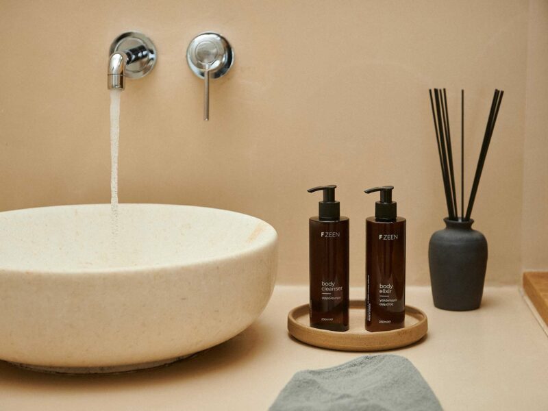Closeup of amenities and sink in bathroom