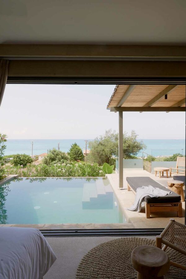 luxurious inside of room overseeing at swimming pool and sea