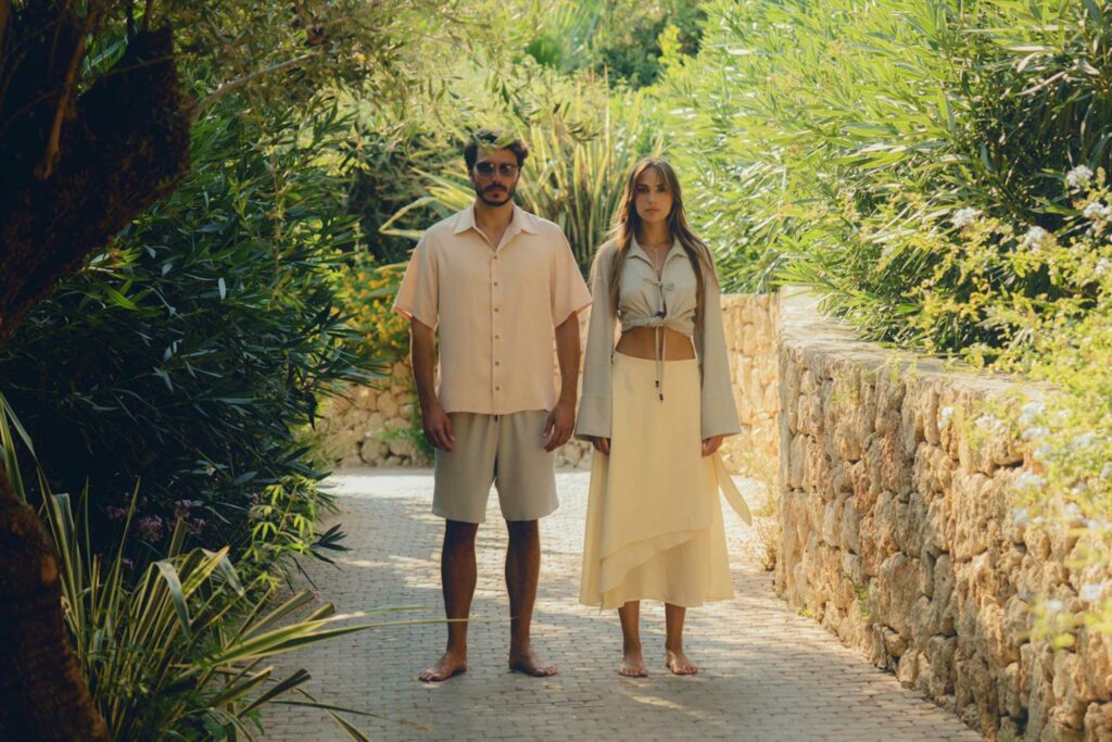 man and woman outdoors in luxurious hotel