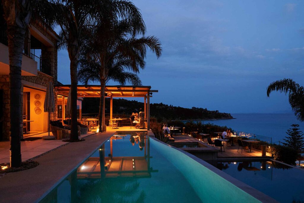 night view of swimming pool and sea F ZEEN KEFALONIA