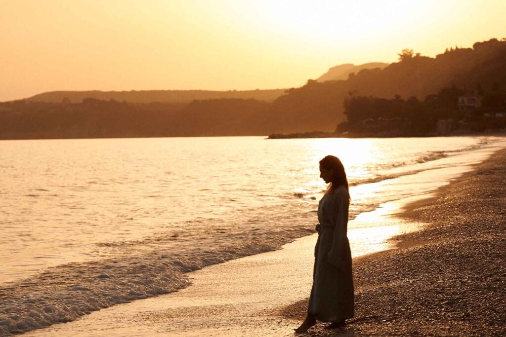 woman at sunset by sea
